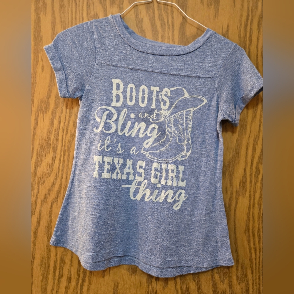 Pretty, light blue, short sleeve graphic t shirt. Great condition.  Size small